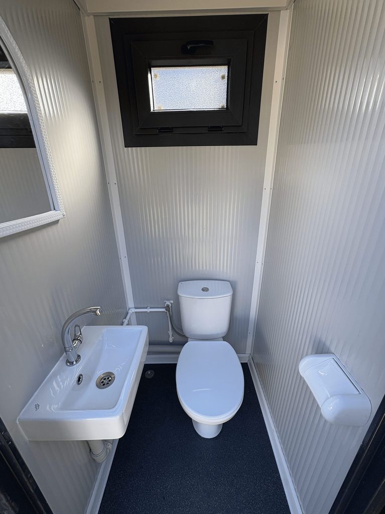 Close-up of the toilet room in a portable toilet and shower unit