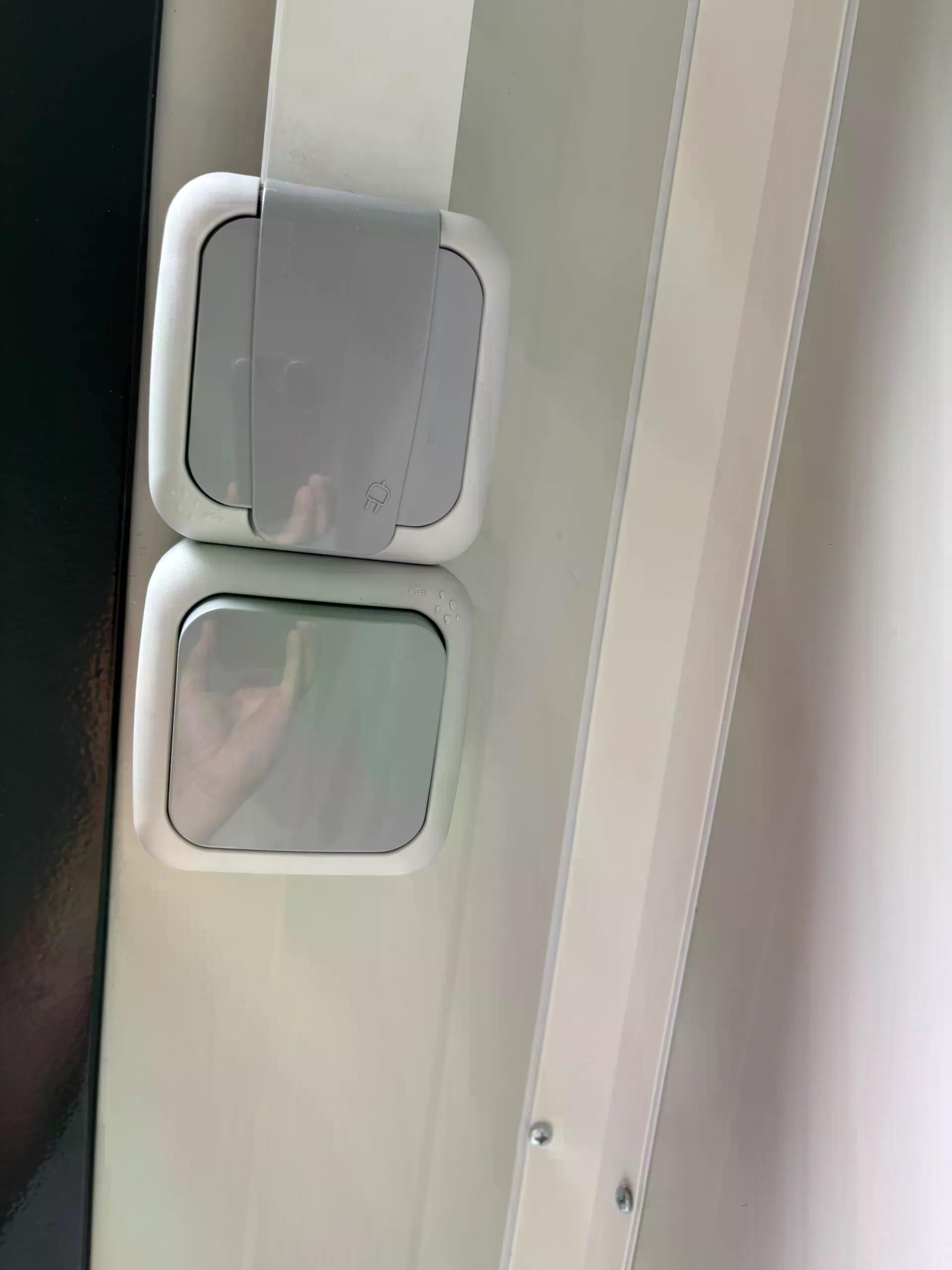 Dual portable shower unit with wall socket and light switch