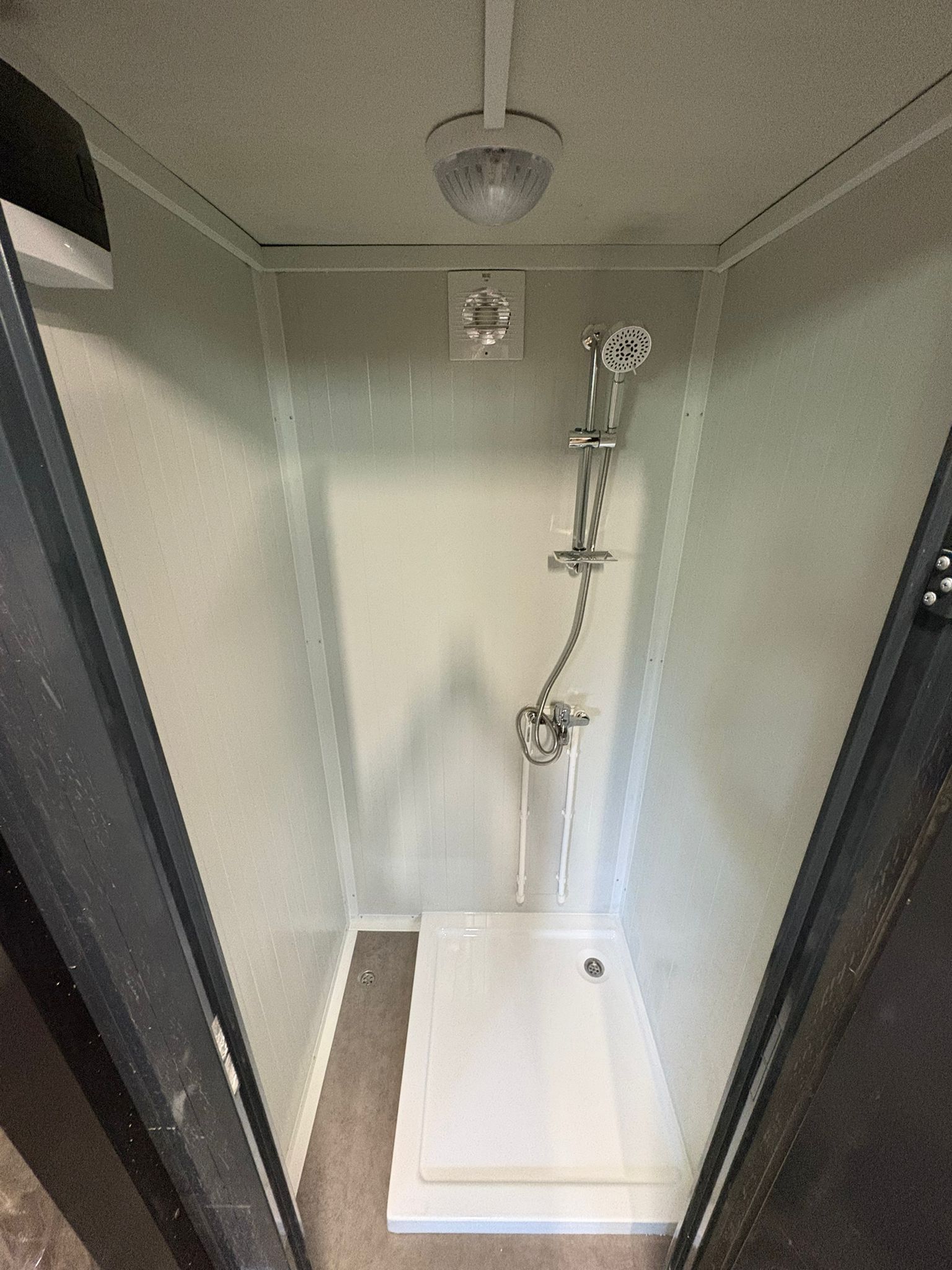 Interior close-up of a luxury portable shower unit for camping