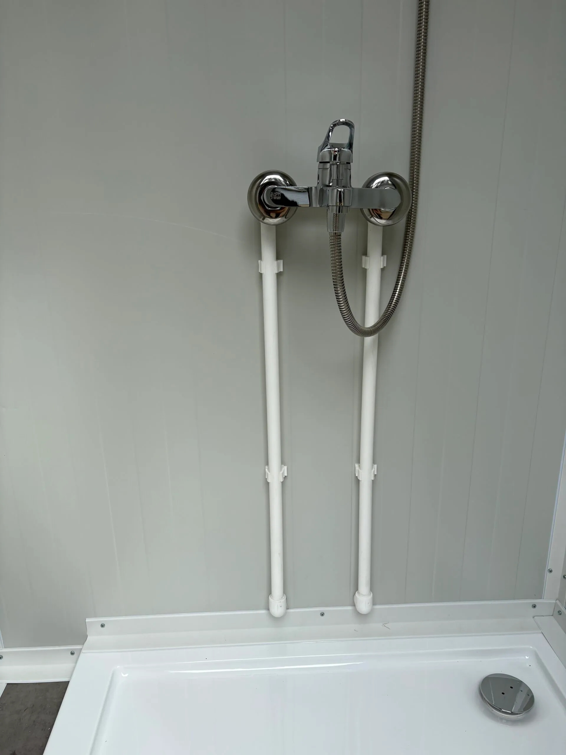 Interior close-up of a luxury portable shower unit for camping