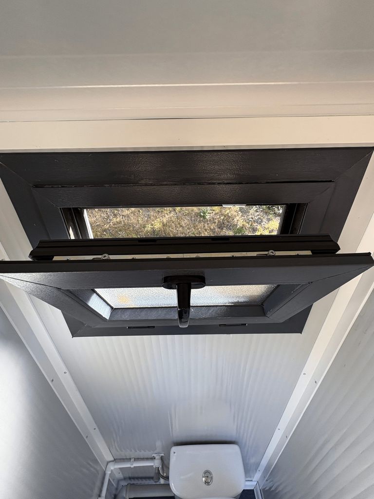 Portable toilet unit for camping with open window